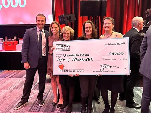 Members of Unverferth House Board of Directors Members of Unverferth House Board of Directors accept a check for $30,000, given by OADA